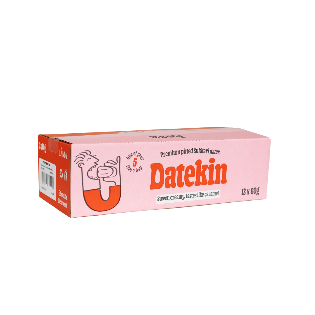 The pink box of Datekin Premium Pitted Sukkari Dates is a healthy snack choice, featuring illustrations and white/orange text. It notes Sweet, creamy, tastes like caramel, offering natural sweetness in 12 packs of 60g each.